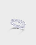 A silver eternity ring featuring a row of clear baguette-cut gemstones in a prong setting.