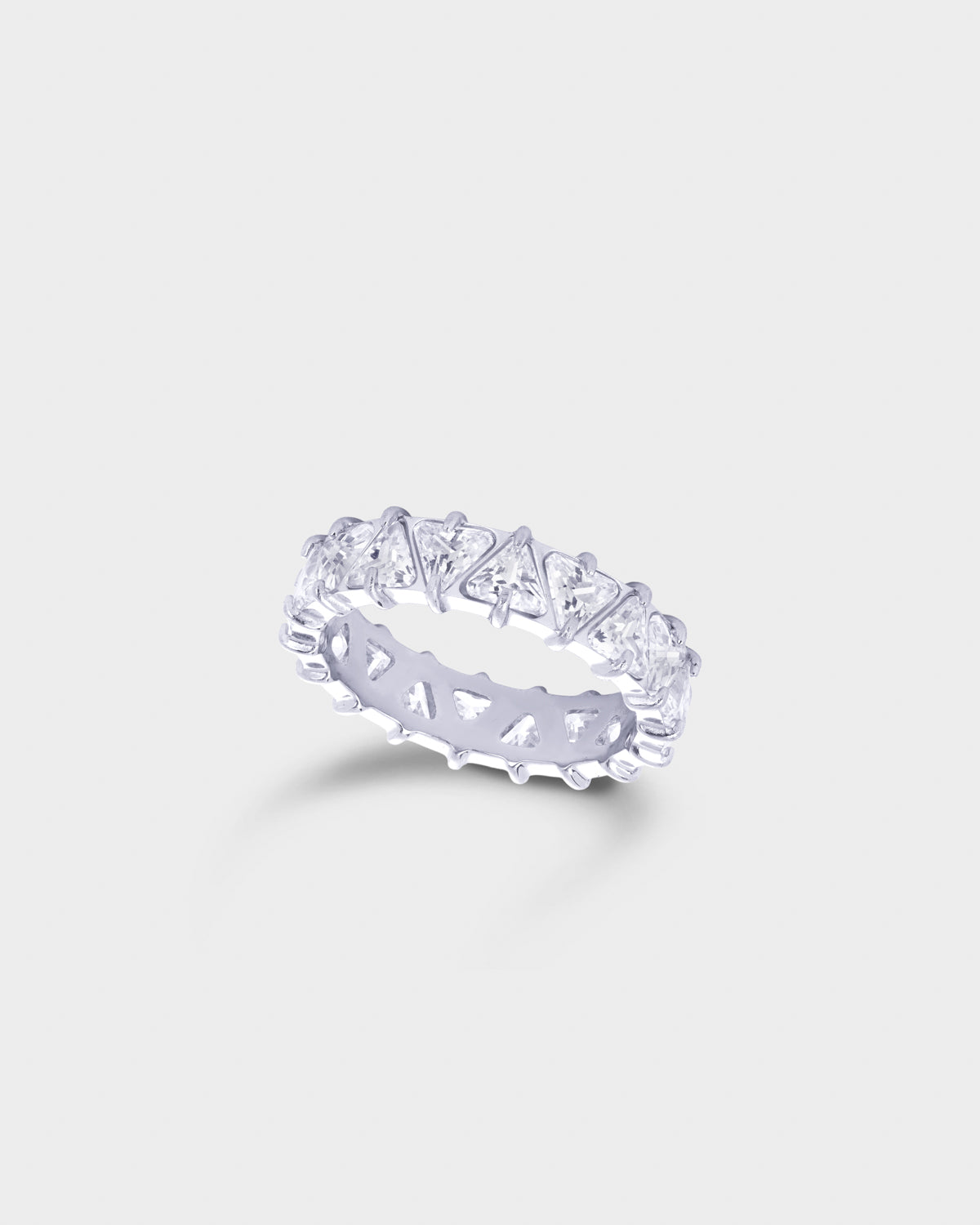 A silver eternity ring featuring a row of clear baguette-cut gemstones in a prong setting.