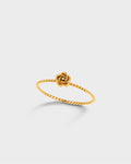 A delicate gold ring featuring a twisted rope-style band and a small rose-shaped flower at the top.