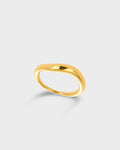 A polished gold band ring with a smooth, rounded organic shape