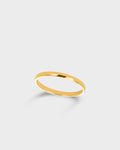 A minimalist, polished yellow gold band ring shown.