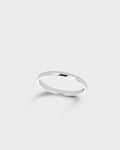 A minimalist, polished silver band ring.