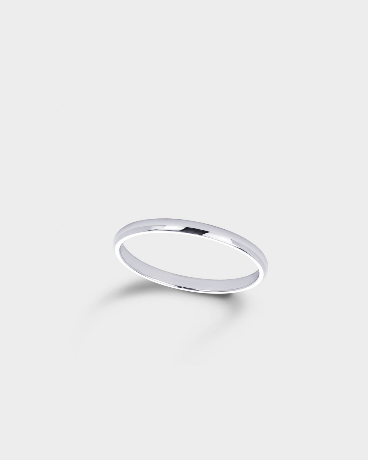 A minimalist, polished silver band ring.