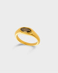 A polished gold signet ring with a green, textured oval stone.