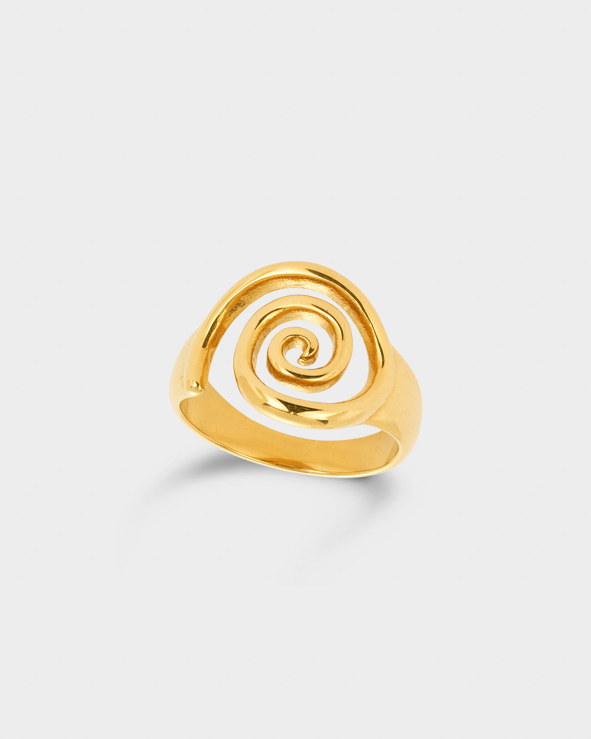 A gold ring with a sculptural, open spiral design.