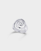 A polished silver ring featuring a sculpted spiral design