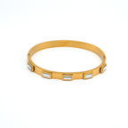 Zara_Gold_White_Bracelet_2

Gold bracelet with embedded stones on a white background